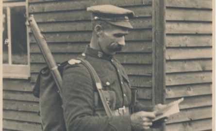 World War 1 soldier holding a journal